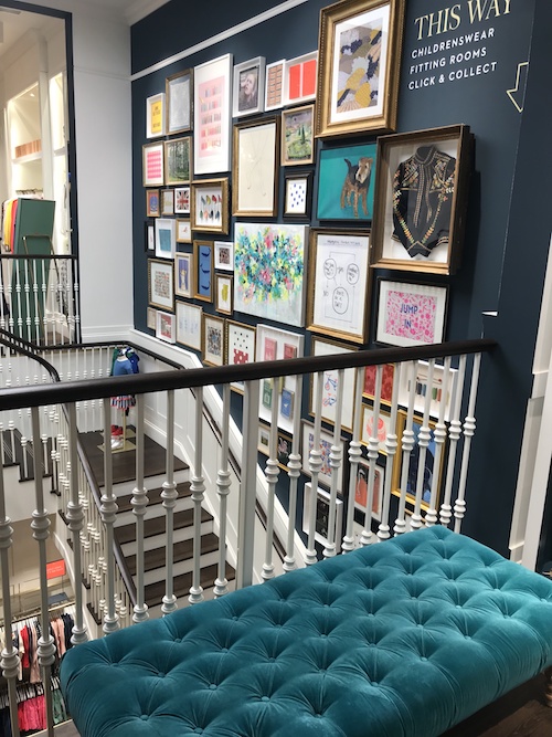 Image of a wall of artwork at the Boden store