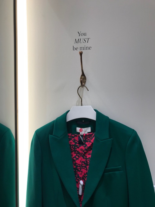 Image of a blazer on a hangar with the phrase You must be mine written above at the Boden store